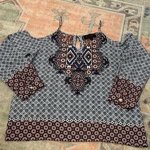 Boutique style long sleeve top. Shoulders cut out with spaghetti strap detail.